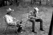 Cow whip maker George "Junior" Mills (l) and his apprentice J. Taylor Marcus working - Okeechobee, Florida.