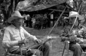 Cow whip maker George "Junior" Mills (l) and his apprentice J. Taylor Marcus at work - Okeechobee, Florida.