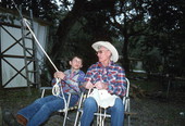Cow whip maker George "Junior" Mills (r) and his apprentice J. Taylor Marcus working - Okeechobee, Florida.