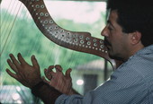 Jose Palmi playing harp