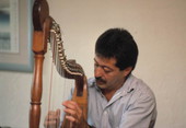 Jose Palmi playing harp