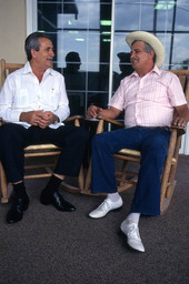 Cuban guajiro singer Meliton Perdomo, right, listens as his apprentice, Mario Brito, sings a decima - Medley, Florida.
