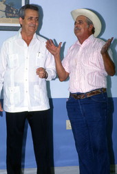 Cuban guajiro singer Meliton Perdomo, right, singing a decima as his apprentice, Mario Brito, listens - Medley, Florida.
