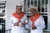 Cuban guajiro apprentice, Mario Brito, left, smiles as Meliton Perdomo sings a decima - Medley, Florida