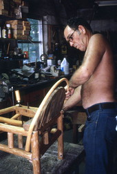 Furniture maker Robert James Rudd fitting a piece of cypress over a frame - Lake Worth, Florida.