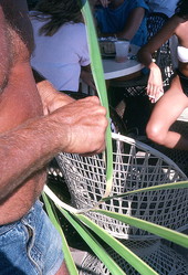 Palm frond hat maker Vic Simmons weaving a hat - Boynton Beach, Florida.