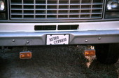 Tag on the front of cypress furniture maker's truck - Bronson, Florida