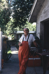 Frog hunter Norman Padgett standing next to his garage and shop - West Palm Beach, Florida