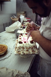 Baker Mike Caforio decorating cake - Lake Worth, Florida.