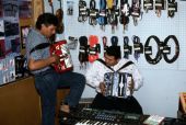Norteno accordion player Tomas Granado, left, and his apprentice Abe Arrazola - Homestead, Florida.