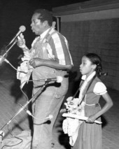 Banjoist and bones player Abner Jay performs with unidentified child at the Florida Folk Festival - White Springs, Florida