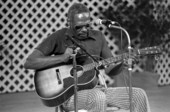Albert "Buck" Thompson playing blues guitar at the 1985 Florida Folk Festival - White Springs, Florida