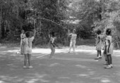 Children playing jump rope in the Children's Folklore Area at the 1985 Florida Folk Festival - White Springs, Florida