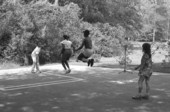 Children playing jump rope in the Children's Folklore Area at the 1985 Florida Folk Festival - White Springs, Florida