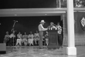 Curly Dekle accepting the Florida Folk Heritage Award from Pat Waterman at the 1987 Florida Folk Festival - White Springs, Florida