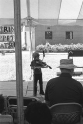 Young boy playing in the Florida State Fiddlers Competition at the 1988 Florida Folk Festival - White Springs, Florida