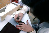 Maria Marulanda making parchment cards at the Traditions Festival - Miami, Florida.
