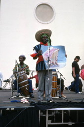 Limone Joseph with conch shell painting and drummers at the Traditions Festival - Miami, Florida.