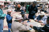 Men playing dominoes at the Traditions Festival - Miami, Florida.