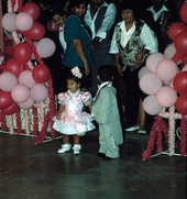 Children stand together at a Quinceanera - Dade County, Florida.