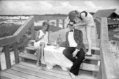 Fashion models on the boardwalk at the beach.