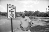 Environmentalist near a lake sign - Tallahassee, Florida.