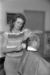 Carolyn, barber, cuts Rulay Pruit's hair - Tallahassee, Florida.