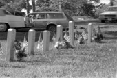 Gravestones with flags during Memorial Day at Oakland Cemetery - Tallahassee, Florida.