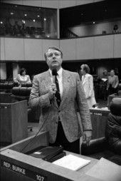 Representative John Cosgrove using microphone at Representative Burke's desk - Tallahassee, Florida.