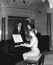 People singing to piano accompaniment during Christmas program at the Stephen Foster Center - White Springs, Florida