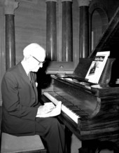Geoffrey O'Hara writing music by piano at the Stephen Foster Center - White Springs, Florida