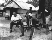 Billy Bowlegs III eating watermelon with Albert DeVane- Big Cypress Reservation, Florida