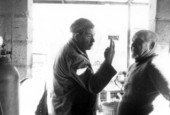 Unidentified man, left, with sculptor Stanley Papio in Key Largo, Florida.