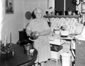 Storyteller Thelma Boltin baking in the kitchen.