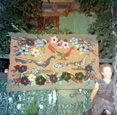 View showing rugmaker Blanche McDonald with the rug she made.