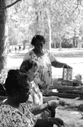 Azie Lee Johnson, Bertha Scoions, and Phillis Eisman making root dolls: Dade County, Florida