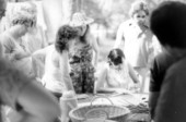 Participant in a basketry workshop making a basket at the July 4th Celebration- White Springs, Florida