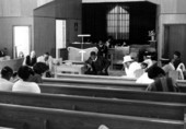 Congregation praying at Mt. Mariah Primitive Baptist Church- Lamont, Florida