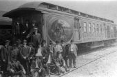 Men standing by Barnum & Bailey circus railroad car