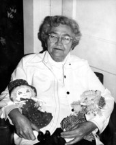 Grace Langdale holding her handmade square dance dolls - White Springs, Florida