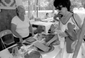 Mebelen Holloway displaying her pine needle baskets at the 1983 Florida Folk Festival - White Springs, Florida