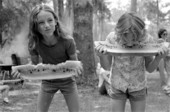 Girls competing in a watermelon eating contest during 4th of July celebration - White Springs, Florida