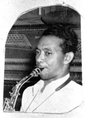 Portrait of Charlie Bruton playing the saxophone - Pensacola, Florida.