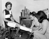 Lunette Twitty, chief of the Florida Park Service Bureau of Fiscal Services, having her leg cast signed - Tallahassee, Florida.