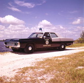 Florida Marine Patrol officer in his vehicle