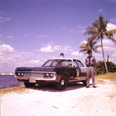 Florida Marine Patrol officer with his vehicle