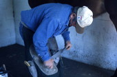 Close-up view showing Randy Minger shoeing a horse at the Spring Garden Ranch Training Center in De Leon Springs, Florida.