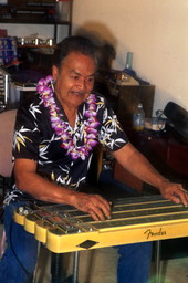 View showing Richard "Dick" Sanft playing the Hawaiian steel guitar at his residence in Kissimmee, Florida.