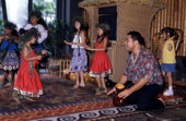 Hula instructor Kawehi Punahele with children at the Disney Polynesian Resort in Orlando, Florida.
