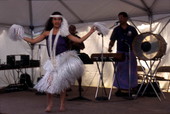 Kaleinani Ohumukini dances while Henry Ohumukini and James Buchin plays at Florida Folklife Festival - White Springs, Florida.